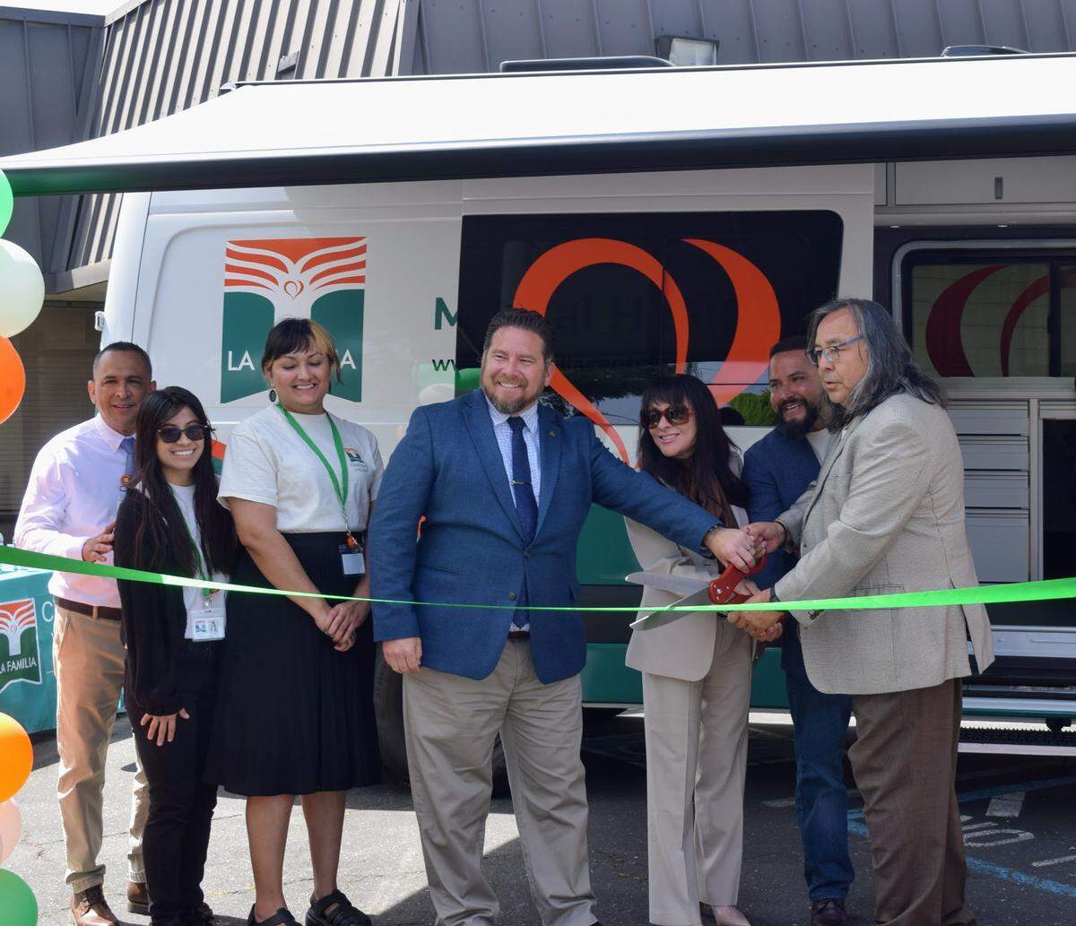 Juan Alanis, Margaret Arechiga, Aaron Ortiz and Manuel J. Jiménez Jr. cut the ribbon for La Familia Central Valley’s launch of the Mobile Mental Health Program in Turlock on Apr. 24, 2025.