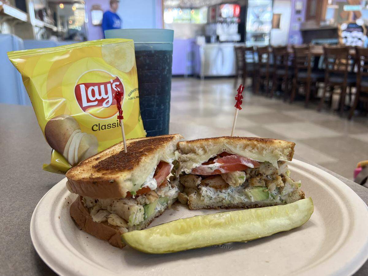 The chicken avocado sandwich is made with grilled chicken, avocado, lettuce, tomato, ranch and Monterey Jack cheese on sourdough for $13.52.