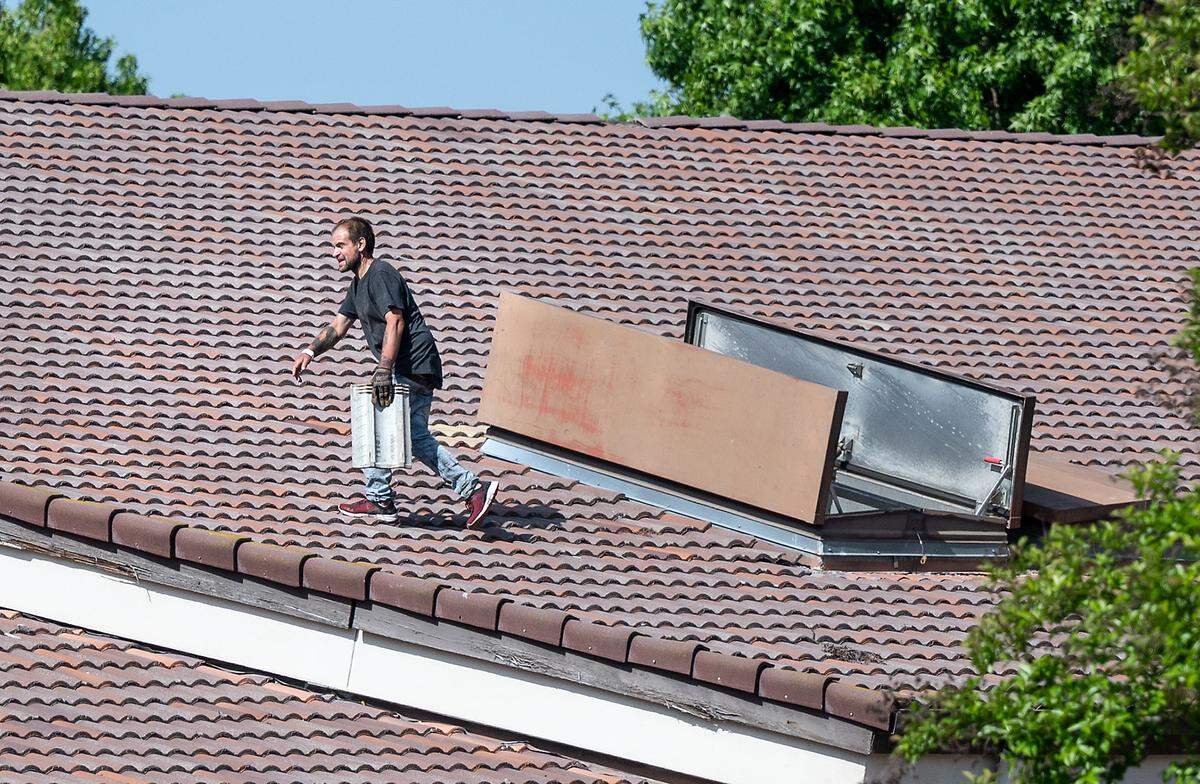 A man was arrested after climbing on the roof of the Church of Jesus Christ of Latter-day Saints church on Dale Road in Modesto, Calif., on Tuesday, April 26, 2022. The man ripped up and destroyed dozens of tiles on the church roof.