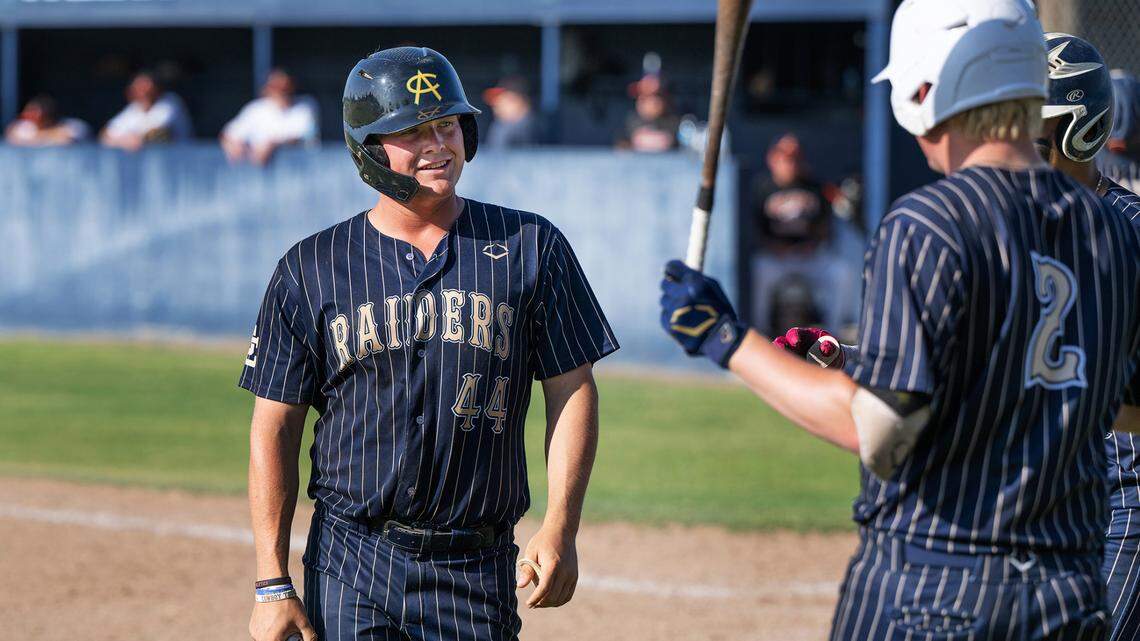 Central Catholic’s Braxton Thomas talks with his teammates during the Northern California Regional Division III semifinal playoff game with Arcata at Central Catholic High School in Modesto, Calif., Thursday, June 1, 2023.
