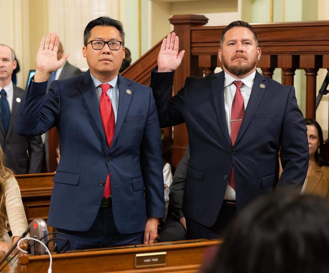 Assemblyman Vince Fong, left, and newly elected Assemblyman Juan Alanis take the oath of office Dec. 5, 2022.