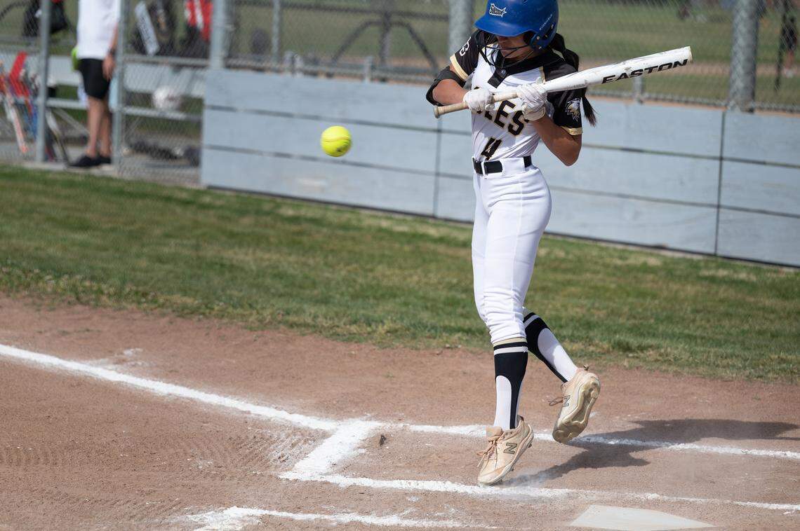 Enochs’ Alaina Calvo takes an inside pitch during the Central California Athletic League game with Modesto in Modesto, Calif., Tuesday, April 18, 2023.