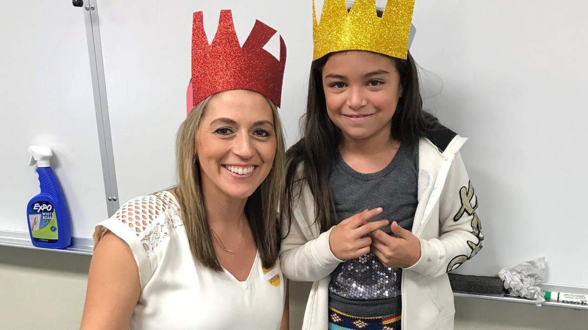 Mentor Jaime Flores poses with her mentee, Orville Wright Elementary School student Adriana.