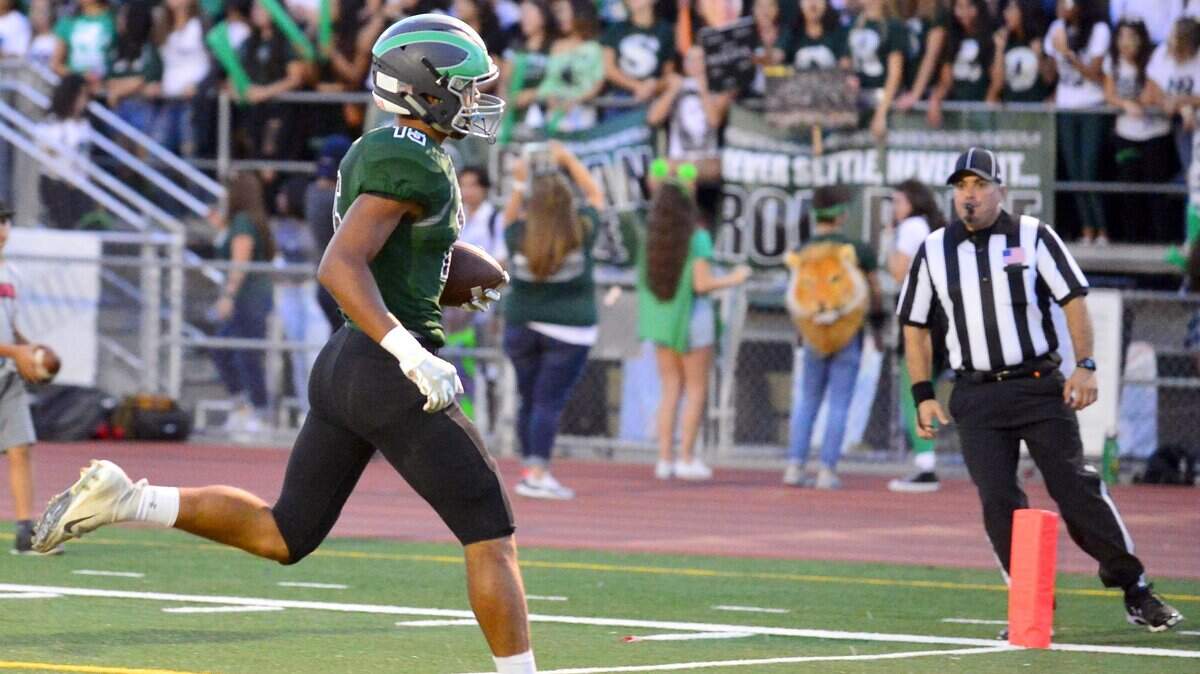 Pitman’s Payton Bass steps into the end zone for a touchdown during a game between Pitman and Summerville High School at Turlock High School in Turlock CA on September 14, 2018.

