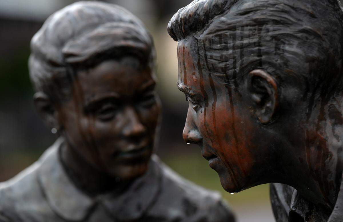 Rain water rolls down the American Graffiti sculpture at Five Points in Modesto, Calif., Thursday, March 9, 2023.