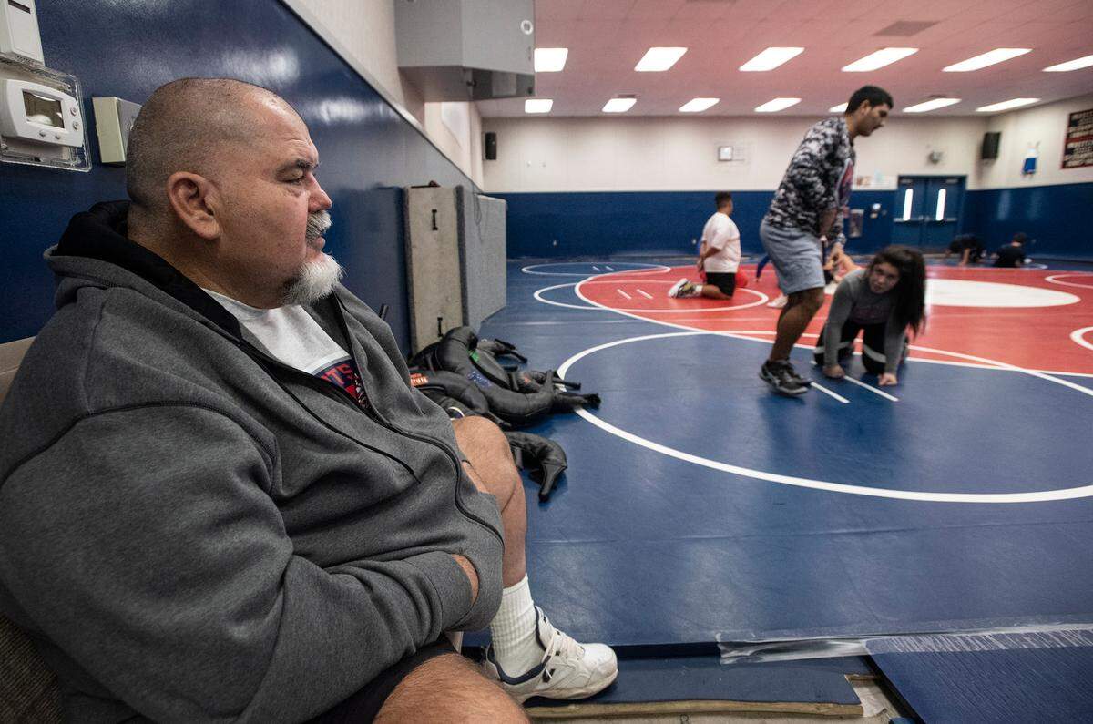 Head coach Doug Severe watches his wrestling team practice at Beyer High School in Modesto, Calif., on Monday, Dec. 20, 2021.