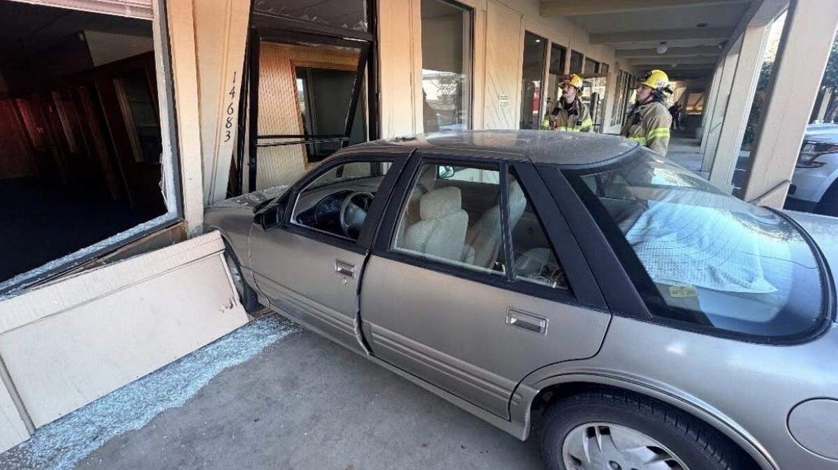 A vehicle rests against a commercial building after a driver accidentally pressed the gas pedal instead of the brake while parking on Mono Way in Sonora on Feb. 4, 2026, according to the California Highway Patrol. No injuries were reported.