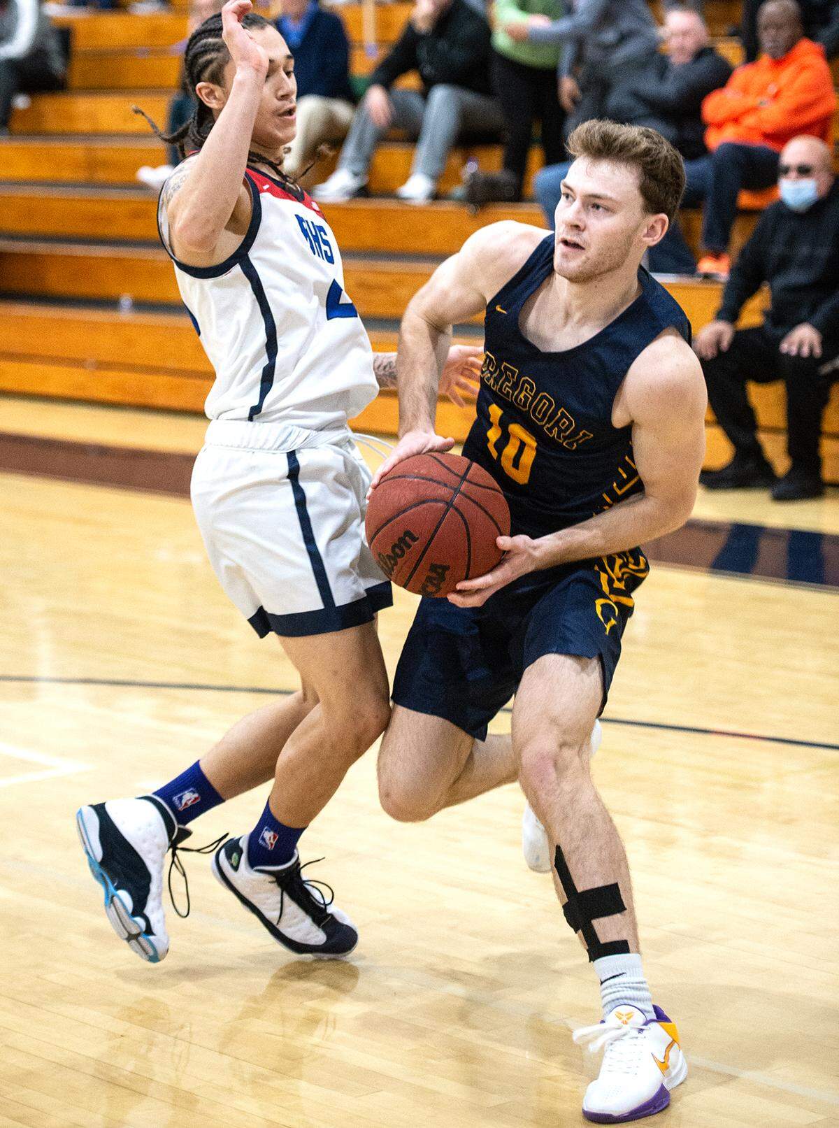 Gregori’s Kobe Nunes, right, looks to pass as Beyer’s Gio Primofiore defends during the Holiday Hoop Classic at Modesto Christian High School in Salida, Calif., on Tuesday, Dec. 28, 2021.