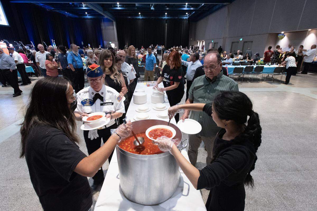 Volunteers Dalya Sun, right, and Sabrina Quintana, left, serve borscht during a dinner which raised money for war victims in Ukraine at Modesto Centre Plaza in Modesto, Calif., on Saturday, June 4, 2022. The Ukrainian city Khmelnitskiy is Modesto’s sister city in that nation.