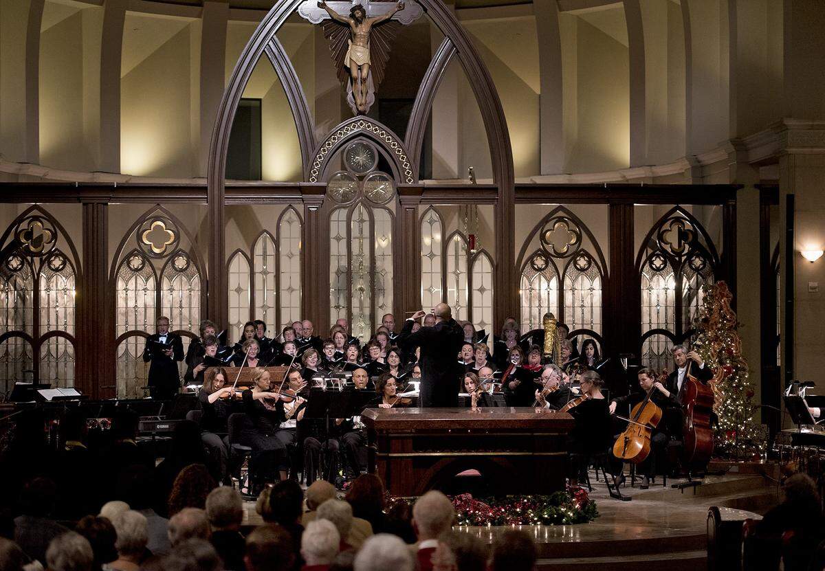 The Modesto Symphony Orchestra and chorus perform during a past year’s Holiday Candlelight Concert at St. Stanislaus Catholic Church in Modesto.