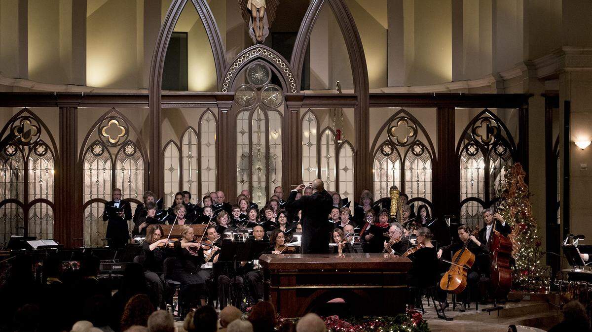 The Modesto Symphony Orchestra and chorus perform during a past year’s Holiday Candlelight Concert at St. Stanislaus Catholic Church in Modesto.