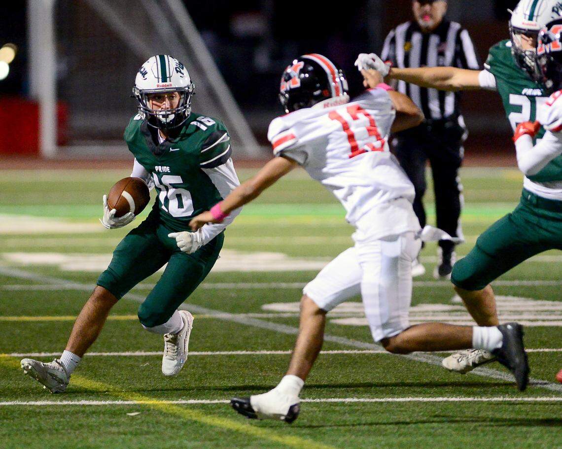 Pitmans Caleb Grossman (16) returns a punt during the game with Modesto at Turlock High School in Turlock, Oct. 3, 2025.