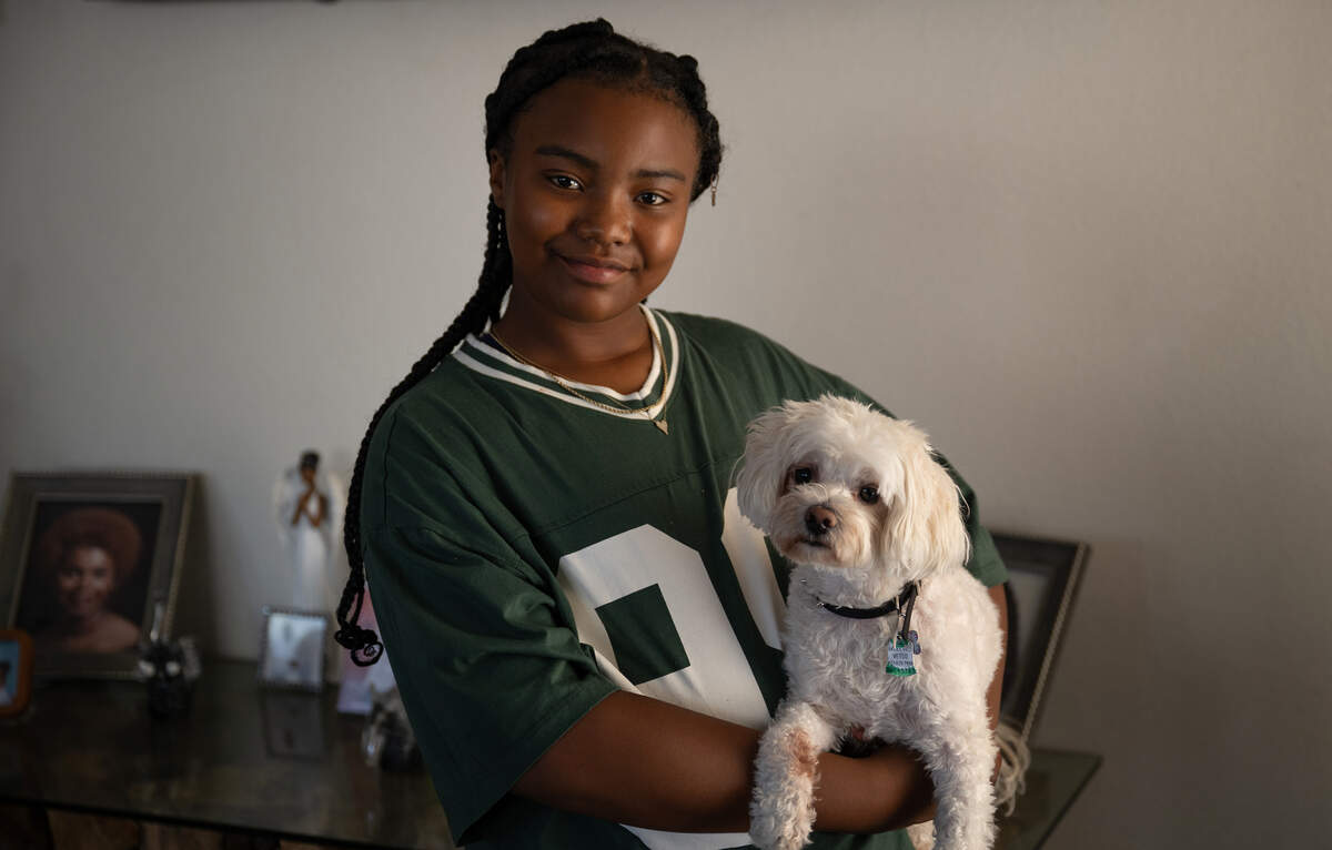 Creekside Middle School student Calaya Hawkins with her dog Newbie.