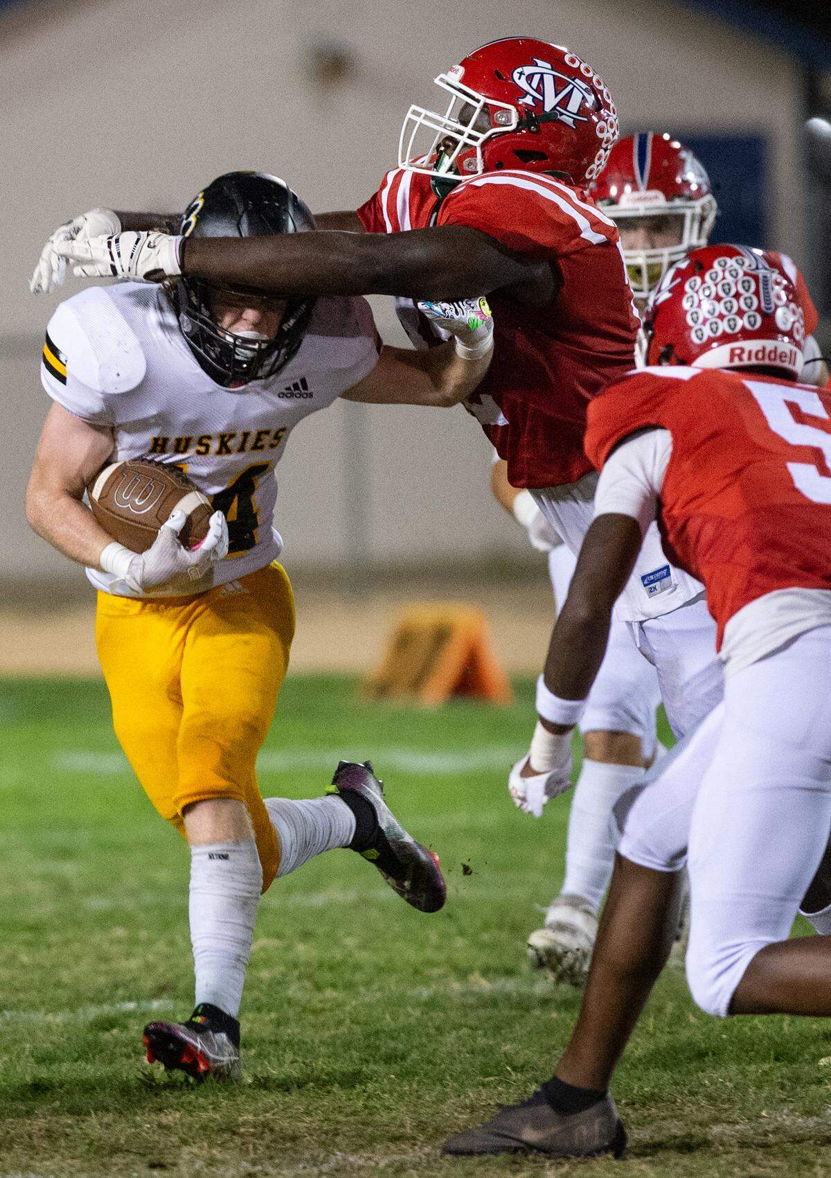 Modesto Christian lineman Manasse Itete wraps up Hughson runner Liam Bridgford during the Trans Valley League game at Modesto Christian High School in Salida, Calif., Thursday, September 29, 2022.