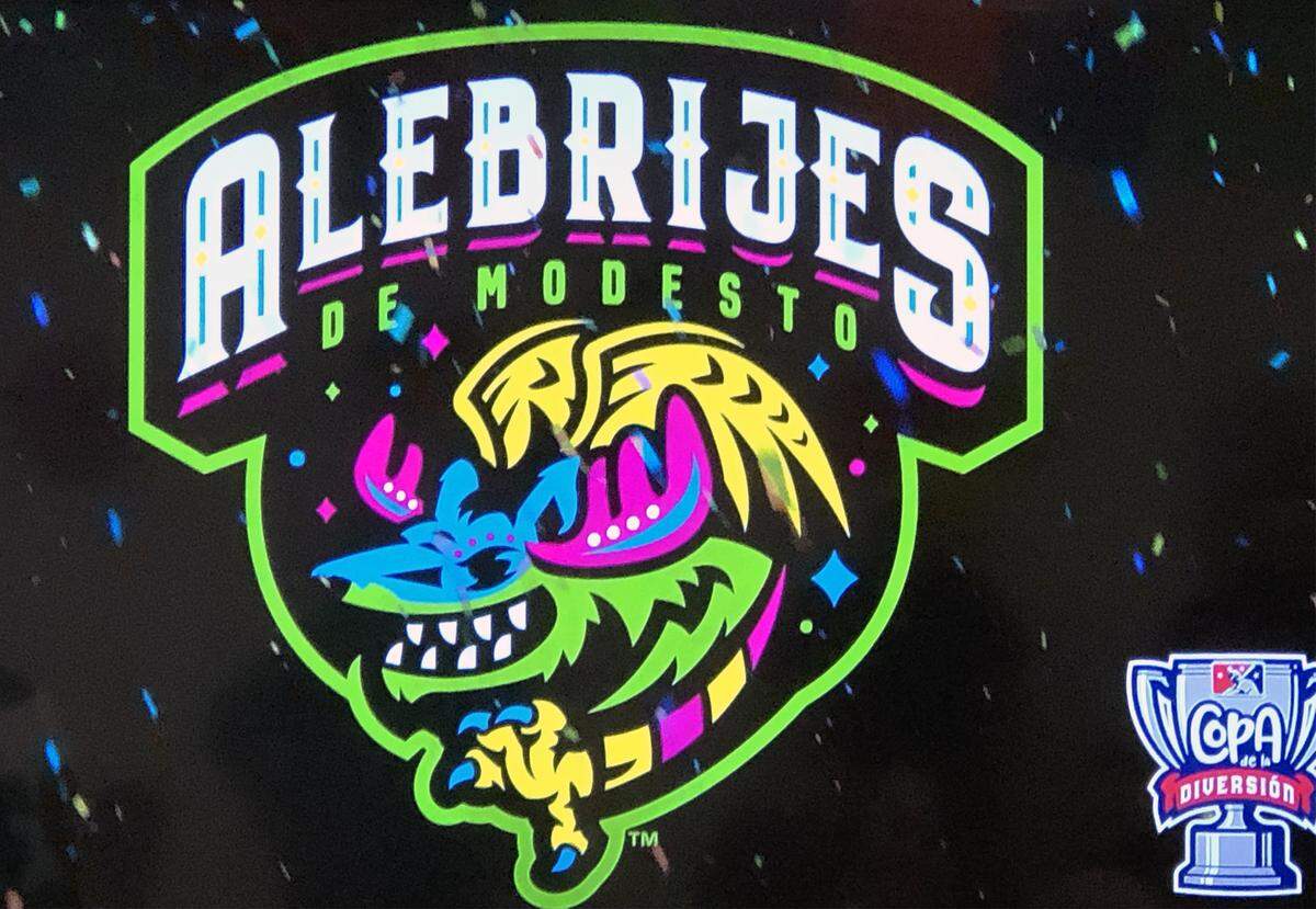 Logo of Alebrijes de Modesto. The Modesto Nuts unveiled a new jersey and hat on Monday March 18, 2019 at the Health Plan of San Joaquin office that they will wear on select nights as part of the “Copa de la Diversion” MiLB program that will embrace the culture and values of some of the hispanic/latino community. For five nights throughout the season, the team will wear Alebrijes de Modesto jerseys and hats.