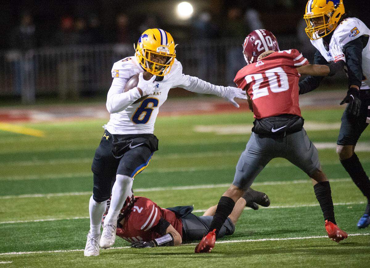 Grant’s Kyrell Goss-Pruitt sprints around the end on a touchdown run after a catch during a Sac-Joaquin Section Division III semifinal against Patterson in Patterson, Calif., on Friday, Nov. 18, 2022. Grant won 80-44.