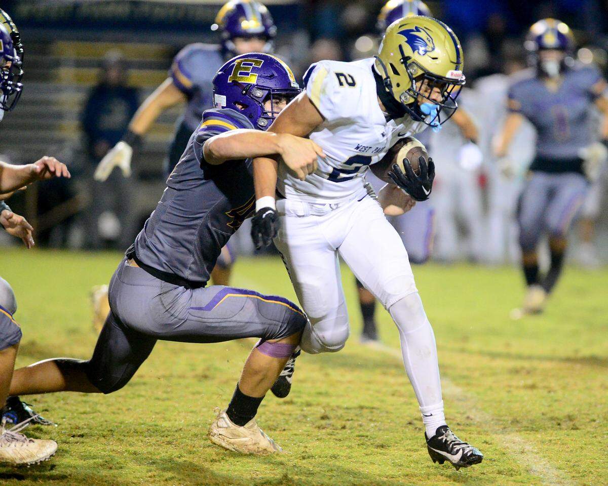 West Park receiver Mason Johnson (2) is chased down by an Escalon defender during a 2023 CIF San Joaquin Section Division IV football game between Escalon and West Park at Escalon High School in Escalon, California, on Nov. 17, 2023. Escalon won the game 48-28.