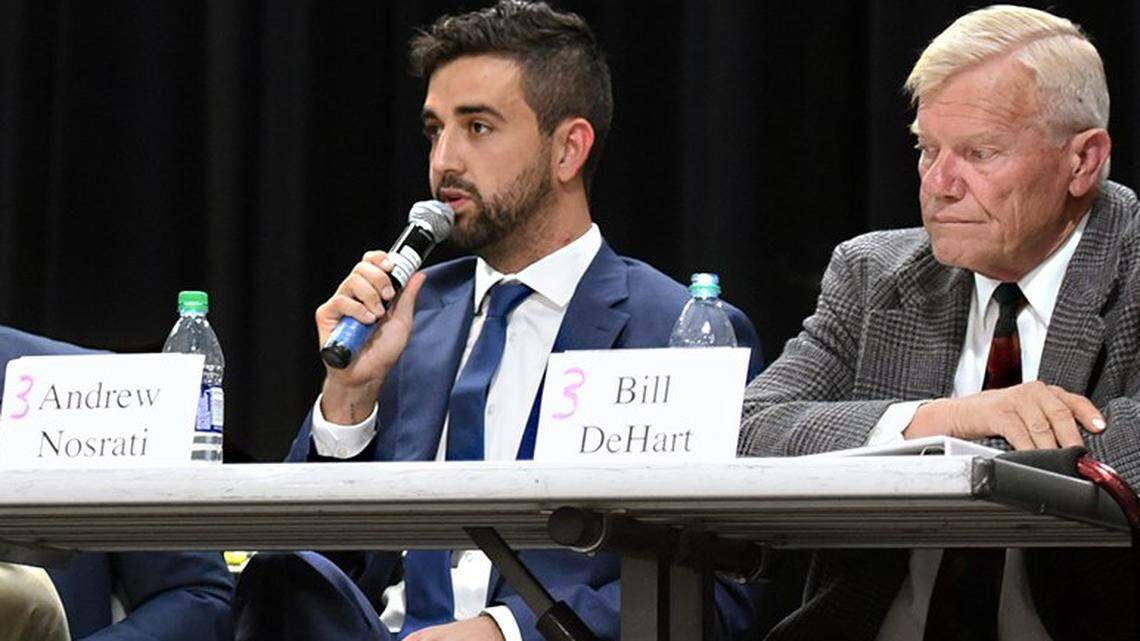 Turlock City Council candidate Andrew Nosrati (second from right) speaks as Bill DeHart looks on Thursday evening October 11, 2018 during the League of Women Voters candidates forum.
