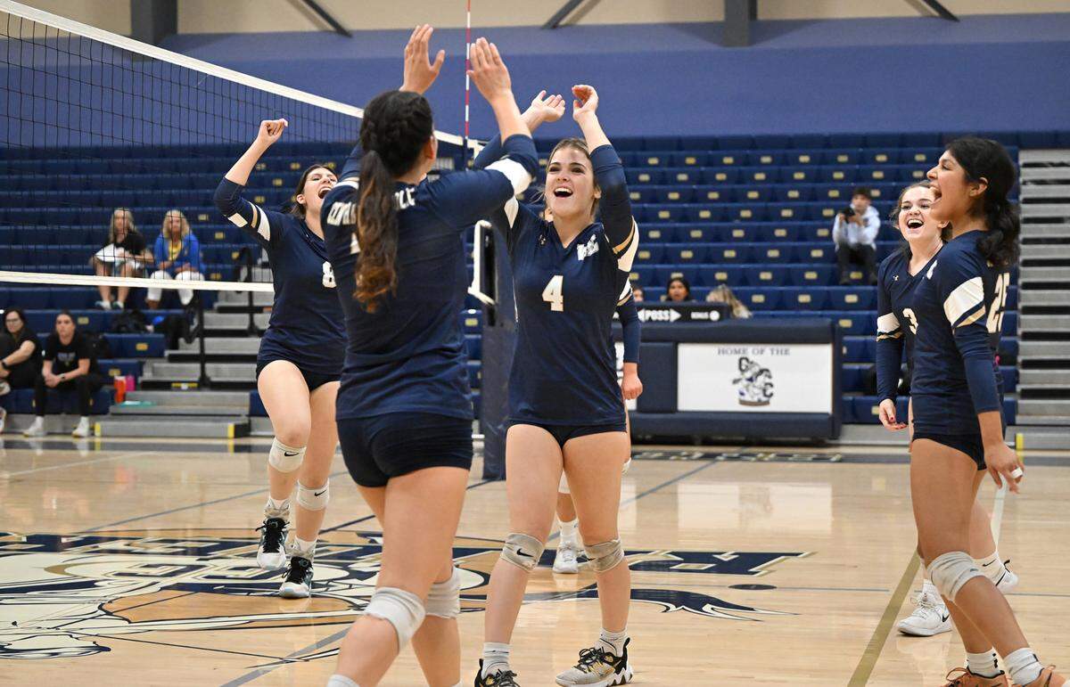 Central Catholic players celebrate their 3-0 victory over Linden during the first round D3 playoff game at Central Catholic High School in Modesto, Calif., Tuesday, Oct. 24, 2023.