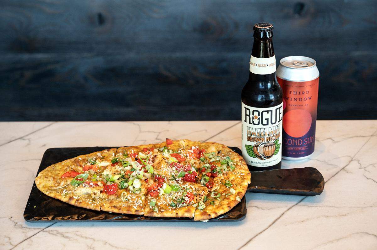 Baja flatbread and craft bottled beer at The Brass Tap in Modesto, Calif., on Friday, April 23, 2021.