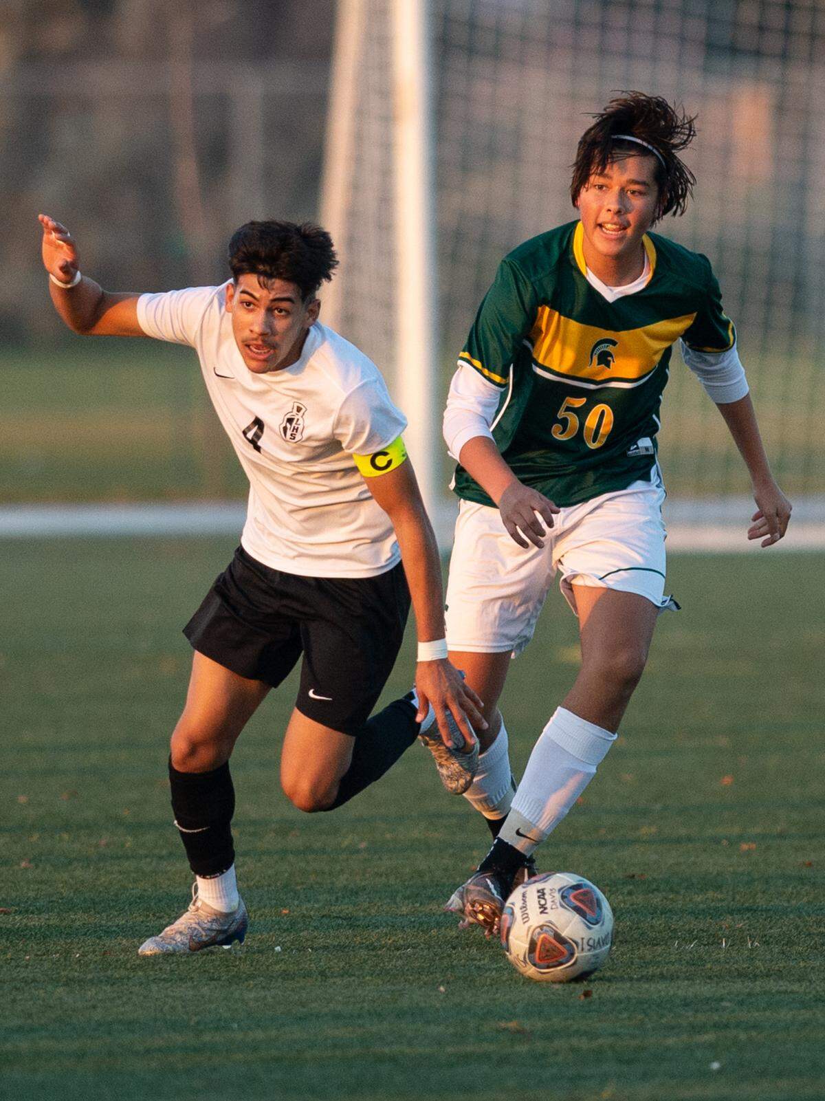 Davis High’s Easton Lund defends as Lathrop’s Ociel Mora receives a pass during the Western Athletic Conference game at Mary Grogan Park in Modesto, Calif., Friday, Dec. 16, 2022.