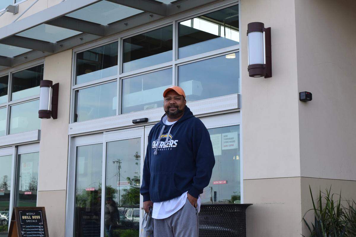 Modesto resident Dominic Taylor stands in front of a Save Mart supermarket at 3401 Oakdale Rd. in Modesto on March 30, 2022.