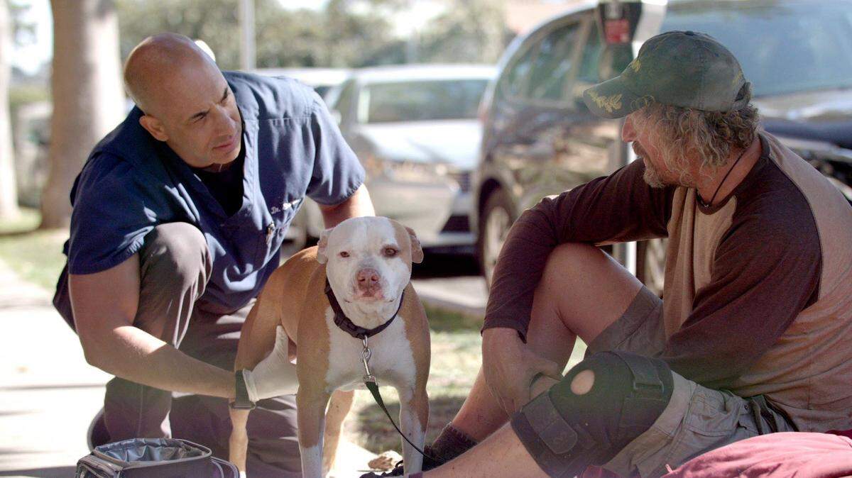 In this undated photo, former Stanislaus County veterinarian Dr. Kwane Stewart offers his services as The Street Vet.