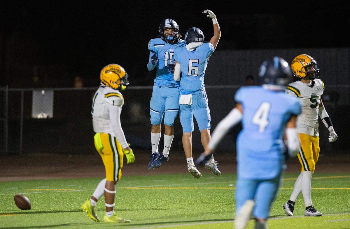Downey’s Camden Rush (10) and teammate Gavin Garcia celebrate a touchdown during the nonleague game with Tracy at Downey High School in Modesto, Calif., on Friday, September 16, 2022. Downey won the game 24-13.