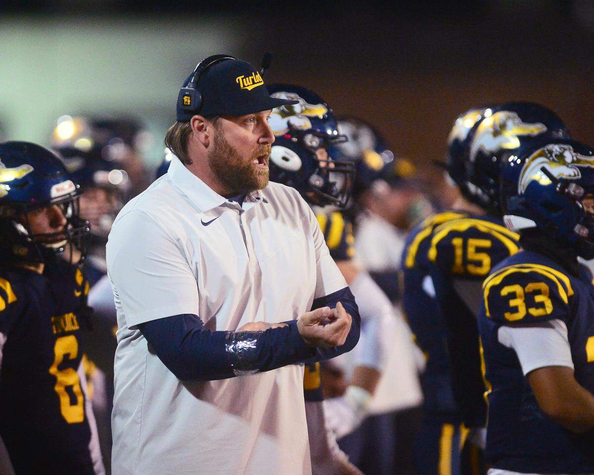 Turlock Head Coach James Peterson yells to his players during a CIF Division I CIF Sac-Joaquin Section Football Playoff game between Turlock High School and Edison High School at Turlock High School in Turlock CA on November 4, 2022. Turlock won 35-0.