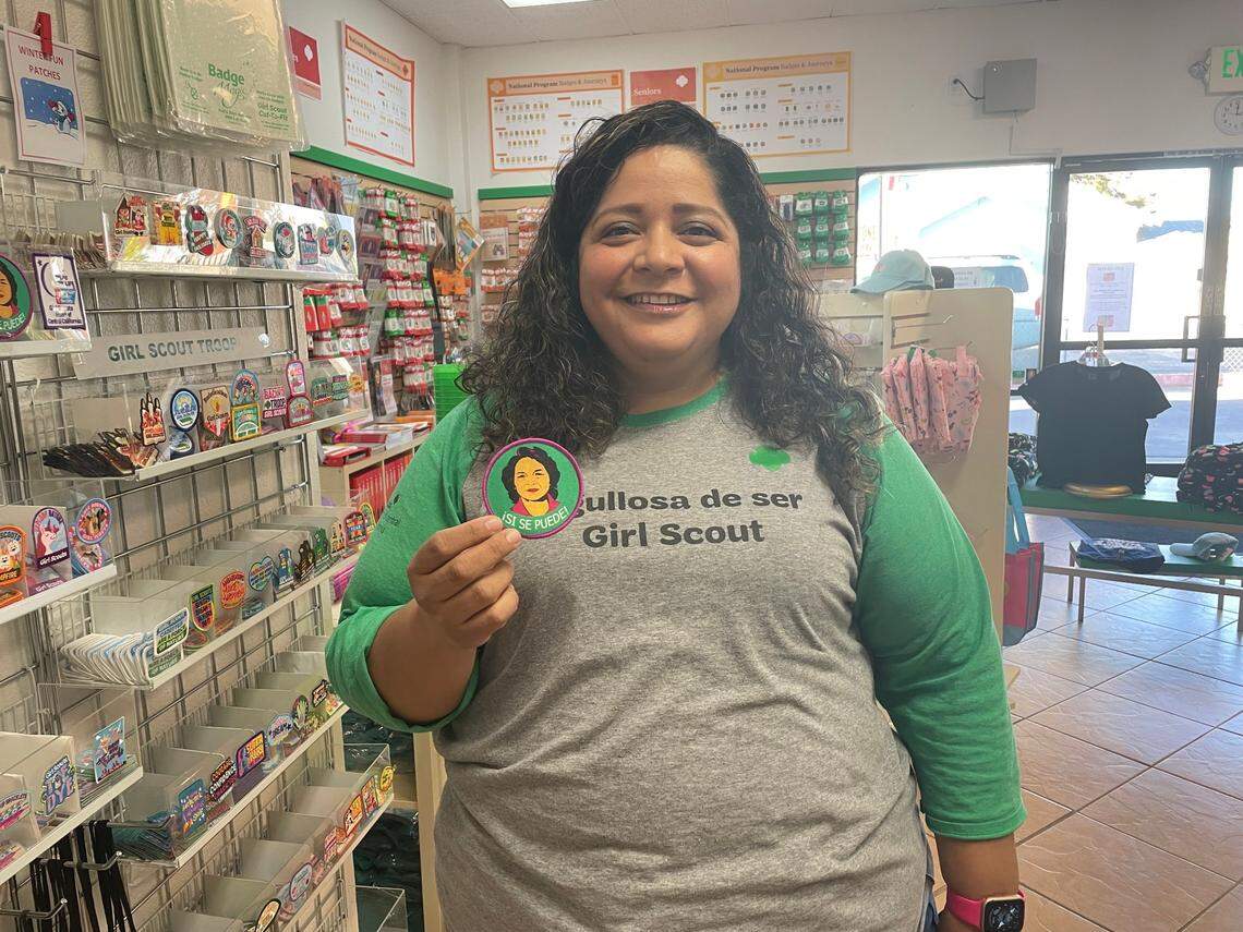 Debbie Avila, recruitment manager for the Girl Scouts, holds up the Dolores Huerta patch at the Modesto Girl Scouts office. The patch was created and copyrighted by her Central California region.