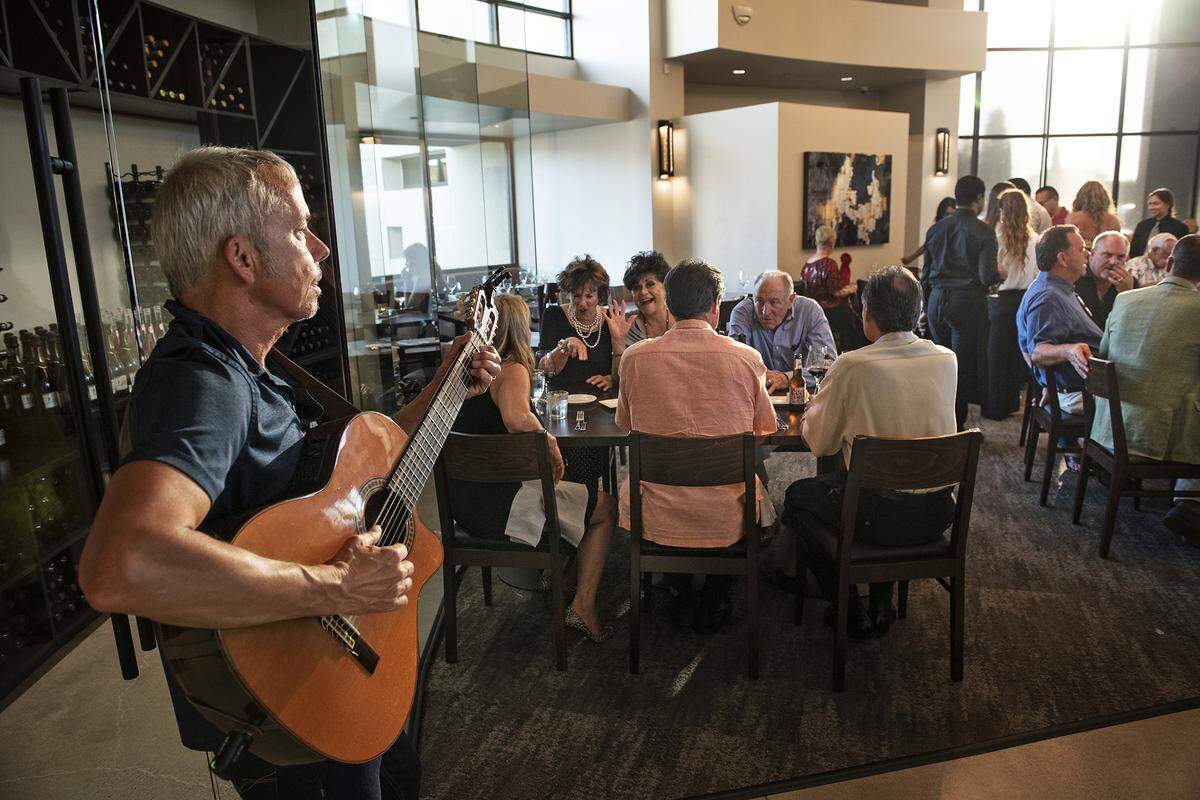Guitarist Darin Morris provides live music during preview night at the new Fina restaurant in Ripon, Calif., Friday, Aug. 2, 2019.