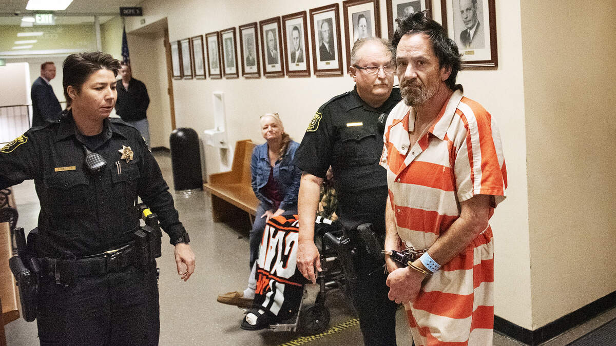 Bryan Ferriera crosses the hallway for his first appearance in Stanislaus Superior Court in Modesto, Calif., Friday, March. 1, 2019.