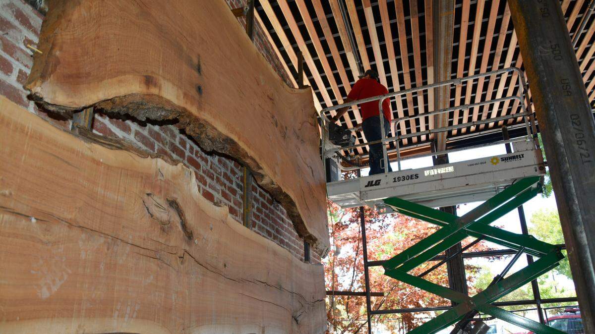 Large live edge wood slabs adorn the walls of what will be the new front entrance bar at the Redwood Cafe in Oakdale, Calif. on May 27, 2021.