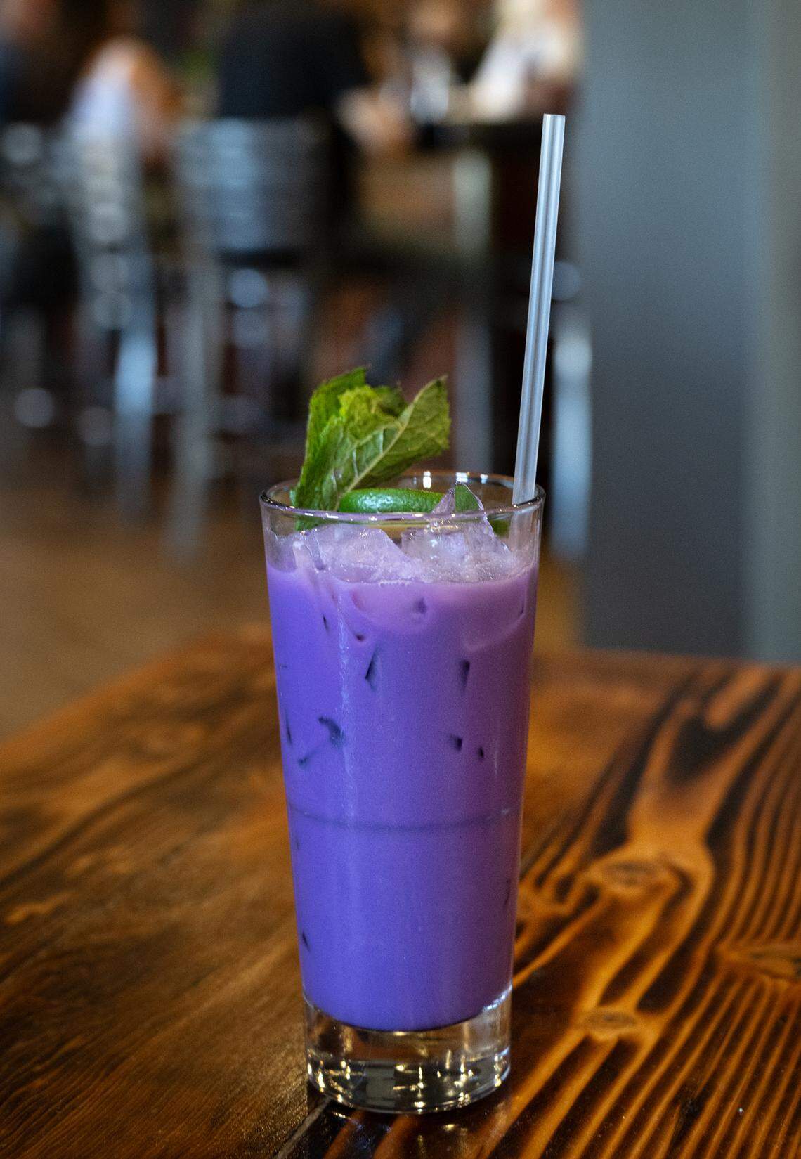 The Purple Pain cocktail (Filipino rum, ube syrup, coconut milk, pineapple and lime) at Cora restaurant at Roseburg Square in Modesto, Calif., Friday, May 24, 2024.