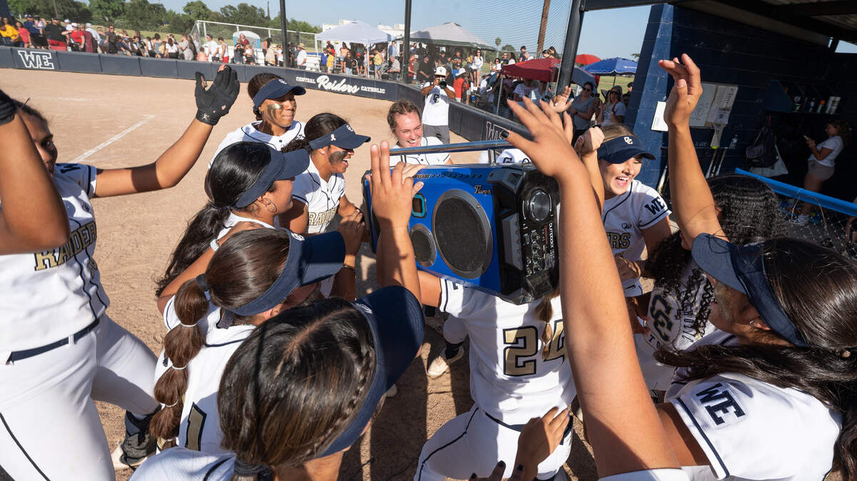 Members of the Central Catholic softball team celebrate their 1-0 win over Oakdale in the Sac-Joaquin Section Division III semifinal game at Central Catholic High School in Modesto, Calif., Tuesday, May 23, 2023.