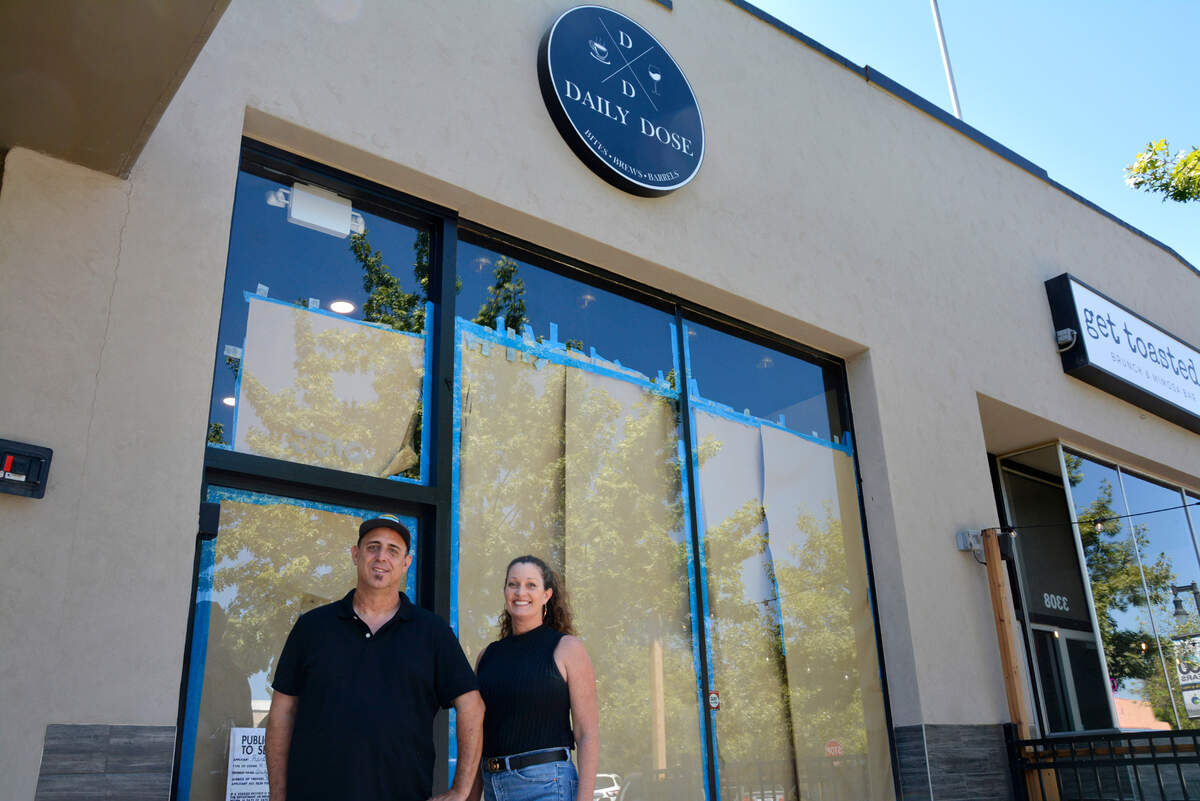 Business partners Randy Rocha and Janet Smallen outside The Daily Dose, the new coffee, beer, wine and small plates restaurant opening in downtown Riverbank, Calif. on Aug. 26, 2022.