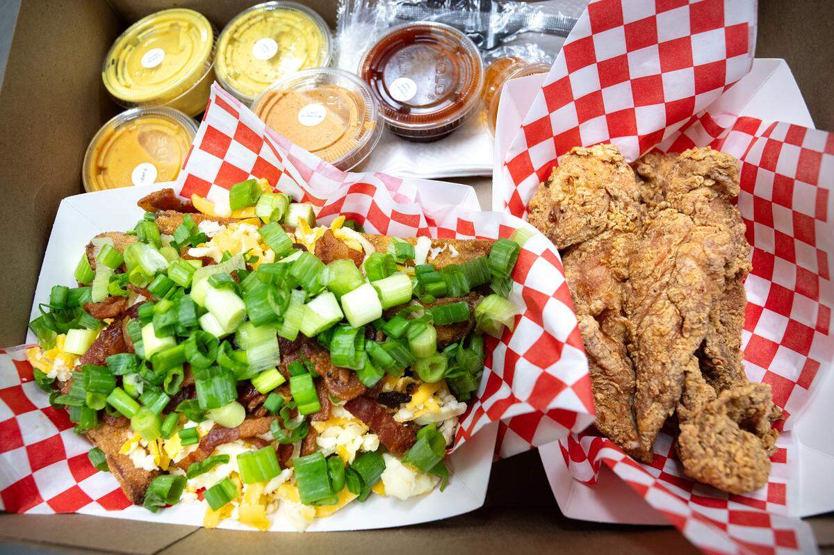 Loaded potato wedges and 4-piece chicken nuggets at Saucin’ it Up in Modesto, Thursday, June 26, 2025.
