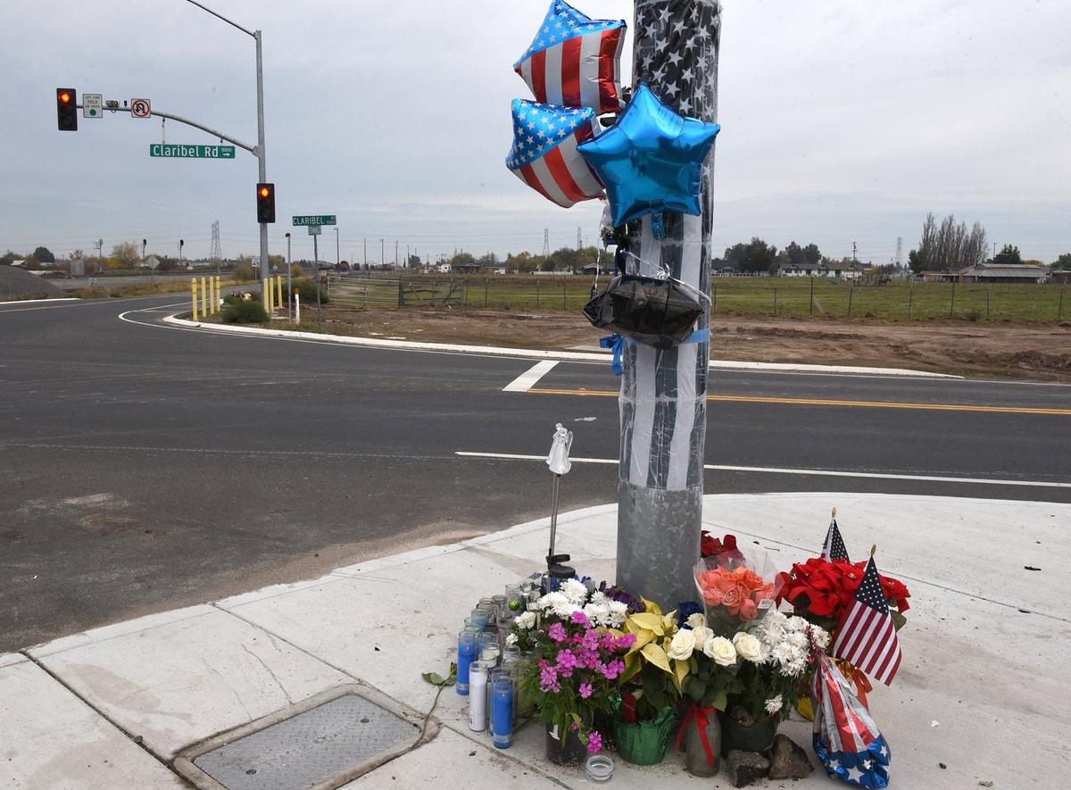 A memorial for Stanislaus County Sheriff’s deputy Tony Hinostroza on Claribel road at Terminal avenue in Modesto,Calif. is pictured on Tuesday December 4, 2018. w