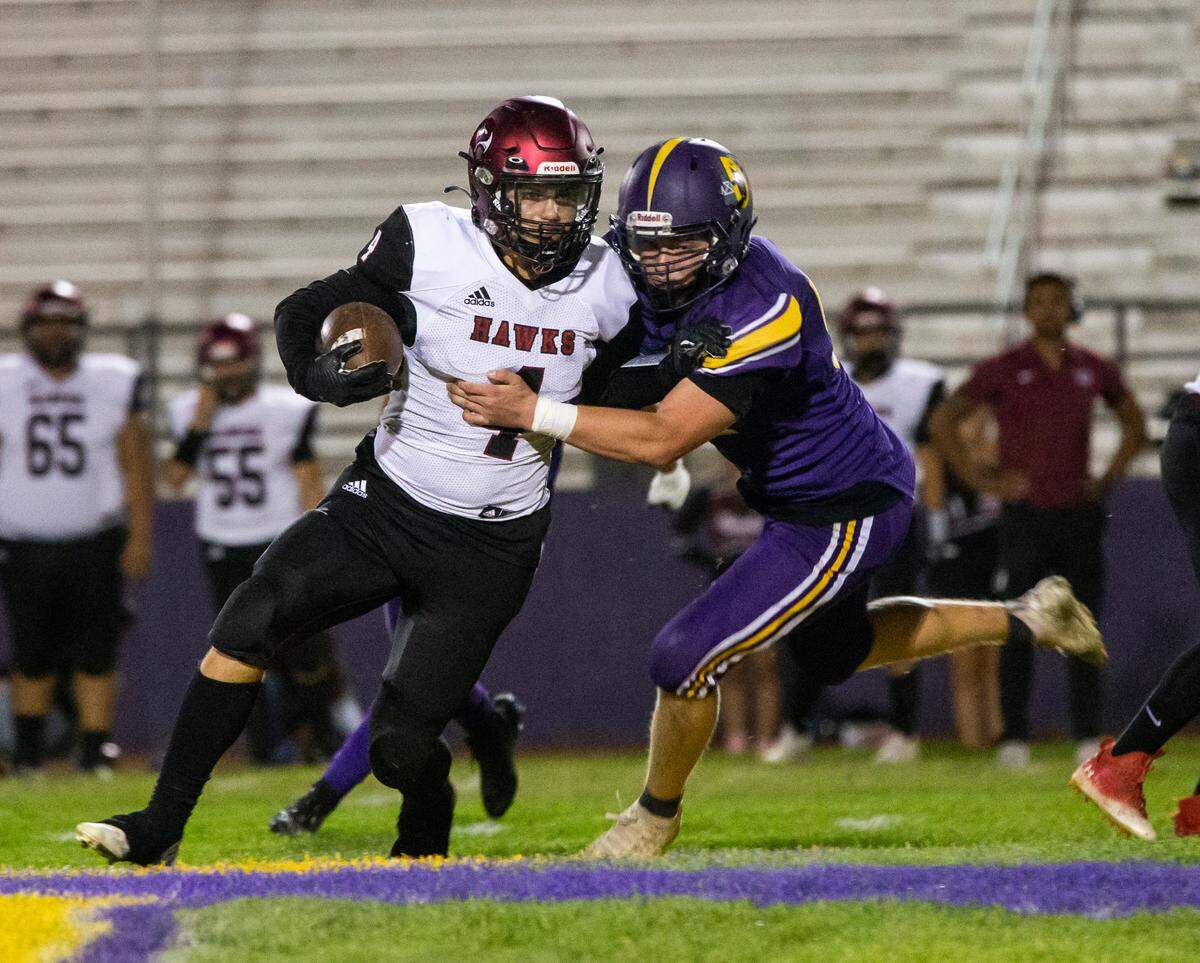 Derek Rosas, 52, of Orestimba gets a grip on Alek Fuentes, 4, of Delhi during play. Orestimba vs Deli at Orestimba Oct. 07, 2022.