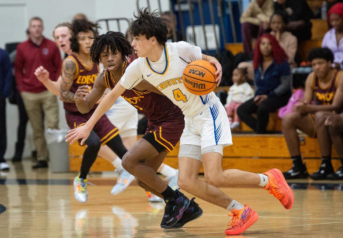 Ripon Christian’s Luke Crivello sets up a play as Edison’s Jehahn Williams defends during the Modesto Christian Holiday Hoop Classic game at Modesto Christian High School in Salida, Calif., Thursday, Dec. 29, 2022.