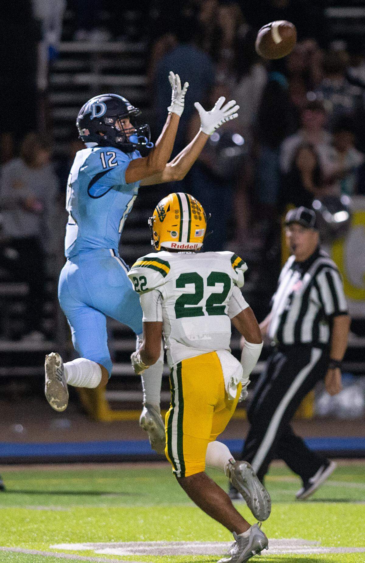 Downey’s Gabe Hernandez reaches up for a catch during the nonleague game with Tracy at Downey High School in Modesto, Calif., on Friday, September 16, 2022.
