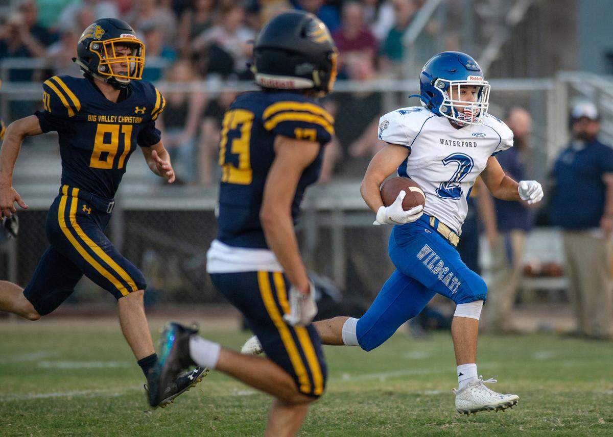 Waterford’s Caleb Hilton breaks out for a long gain during the non-league game with Big Valley Christian at Big Valley Christian High School in Modesto, Calif., on Friday, Aug. 27, 2021.