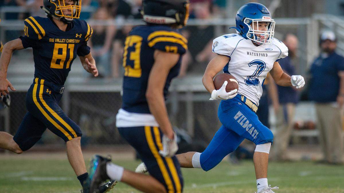 Waterford’s Caleb Hilton breaks out for a long gain during the non-league game with Big Valley Christian at Big Valley Christian High School in Modesto, Calif., on Friday, Aug. 27, 2021.