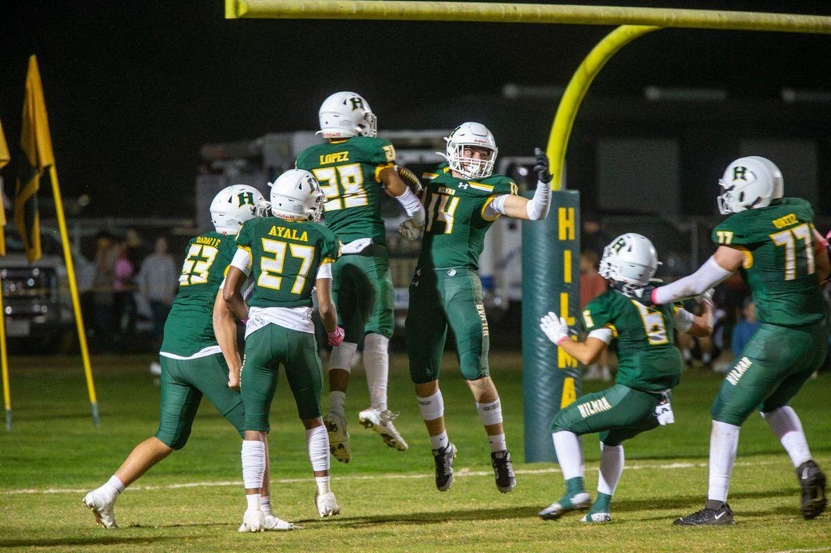 Colton Johnston, 14 celebrates with his Hilmar teammates after scoring a touchdown in the first half of play during the Trans-Valley League game against Hughson in Hilmar, Calif. on Friday Oct. 25, 2024.