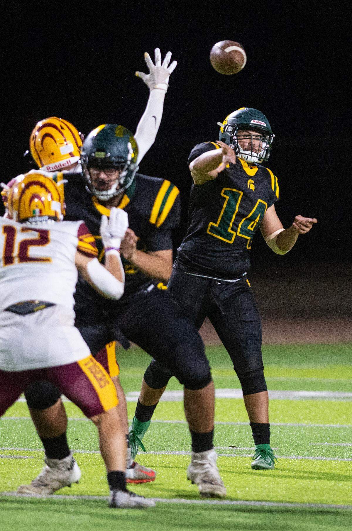 Davis quarterback Adrian Gallegos makes a pass during a Western Athletic Conference game with Los Banos at Downey High School in Modesto, Calif., on Friday, September 23, 2022.