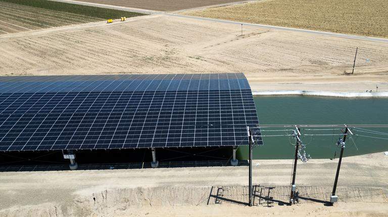 Turlock district, UC Merced test solar panels on canals. State leaders get a peek