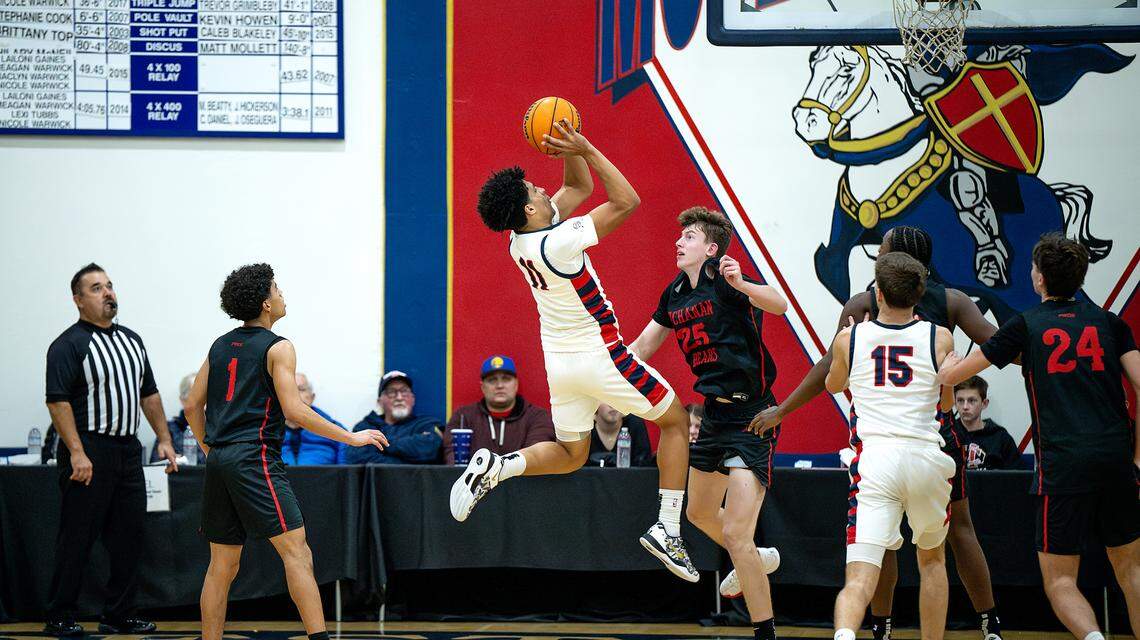 Modesto Christian’s Gavin Sykes with a pull-up jump shot during the Holiday Hoop Classic championship game with Buchanan at Modesto Christian High School in Salida, Monday, Dec. 30, 2024.