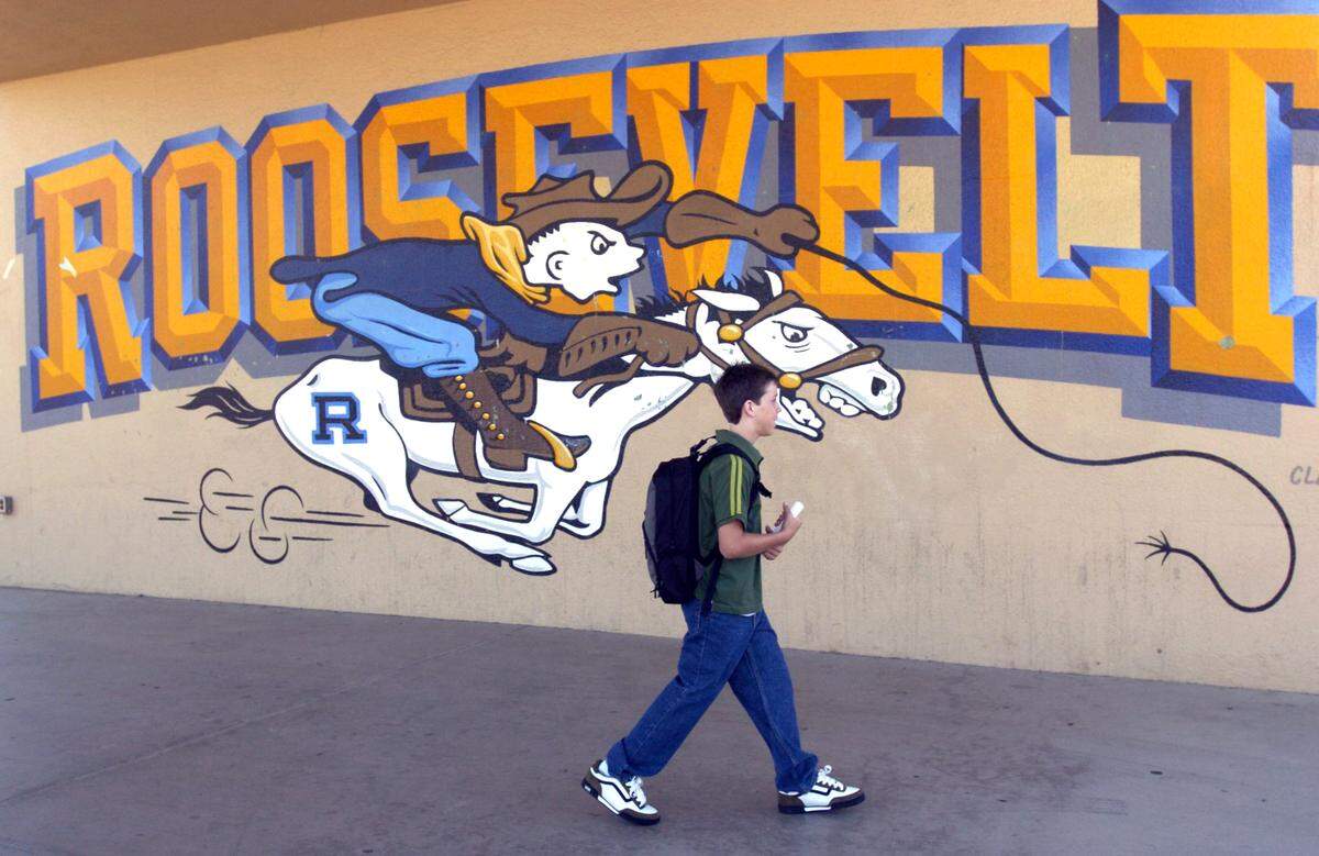 In this 2005 photo, student Evan Crim, 14, walks to class before the first bell on the first day of school at Roosevelt Junior High School in Modesto. The school now is 105 years old.