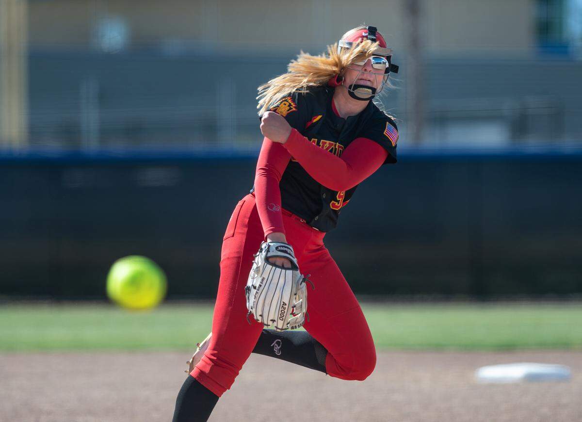 Oakdale’s Delainey Everett delivers a pitch during the Valley Oak League game with Central Catholic at Central Catholic High School in Modesto, Calif., on Tuesday, May 10, 2022. Central Catholic won the game 2-1.