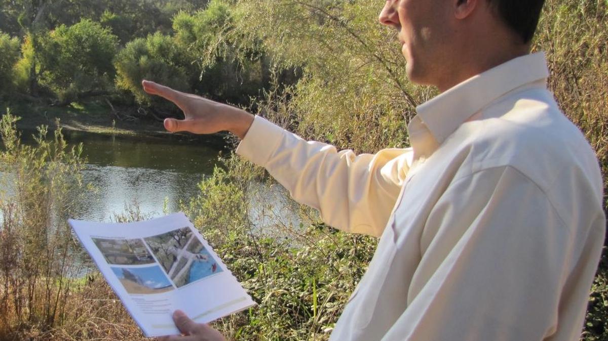 Waterford City Manager Tim Ogden looks over plans for a trail along the Tuolumne River that eventually was completed in 2016.
